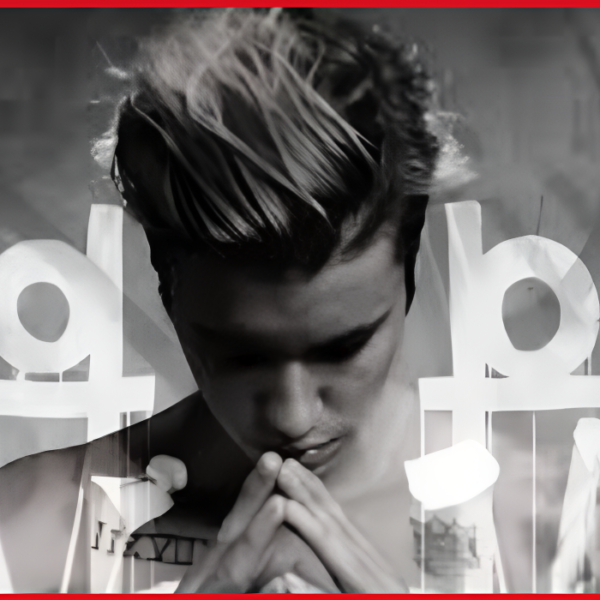Cover of Justin Bieber Purpose album highlighting the artist's intense gaze and emotional expression.